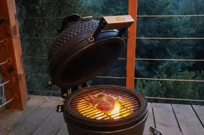 a grill with food cooking in a pot at Chata Cedrus in Hradištko