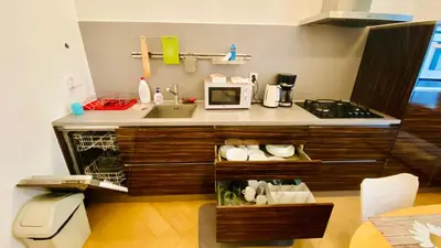 a kitchen with a sink and a microwave at Private room in the Centre in Prague