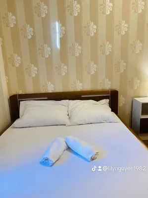a bed with two towels on top of it at Private room in the Centre in Prague