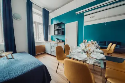 a dining room with a table and chairs at Smichov MixHause Residence by Wagnerstays in Prague