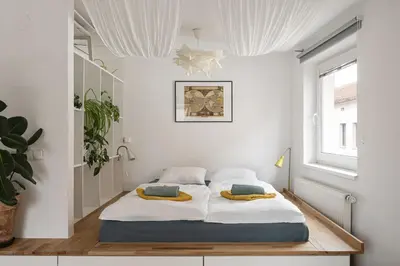 a bedroom with two beds in a room at Sunny studio Prague in Prague