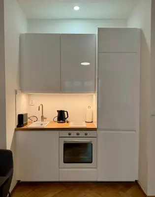 a black table with two chairs in a room at Apartmán U Smaltovny 27 in Prague