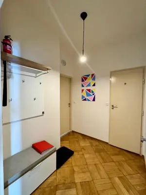 an empty room with a door and a bench in it at Apartmán U Smaltovny 27 in Prague
