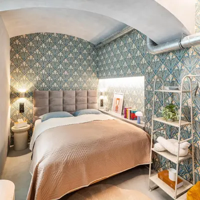 a bedroom with a large bed in a room with wallpaper at Dream Luxury Studio Prague DS1 in Prague