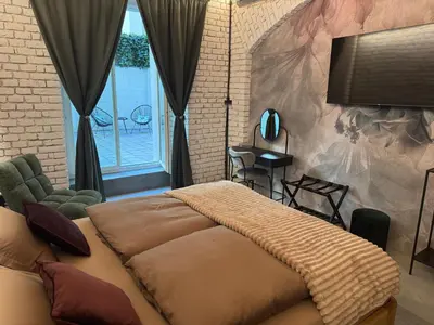 a bedroom with a large bed in front of a window at Dream Luxury Studio Prague DS1 in Prague