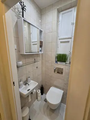 a white table and chairs in a room at Get Prague Flat Slovenska in Prague