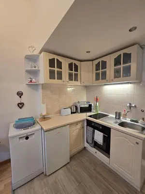 a bedroom with a bed and a table in it at Get Prague Flat Slovenska in Prague