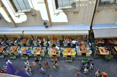 an overhead view of a group of people sitting at tables at Pension Karlova in Prague
