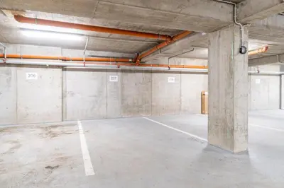 an empty parking lot in an empty parking garage at Brand new studio apartment #50 FREE PARKING close to center in Prague