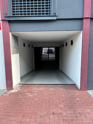 an entrance to a building with a brick walkway at Apartment Vyšehrad in Prague