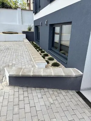 a concrete bench next to a building at Apartment Vyšehrad in Prague