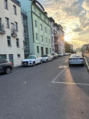 a group of cars parked on a street with buildings at Apartment Vyšehrad in Prague