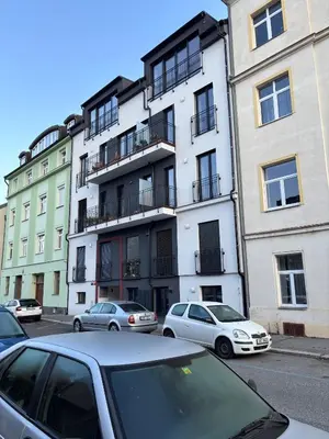 a group of cars parked in front of a building at Apartment Vyšehrad in Prague