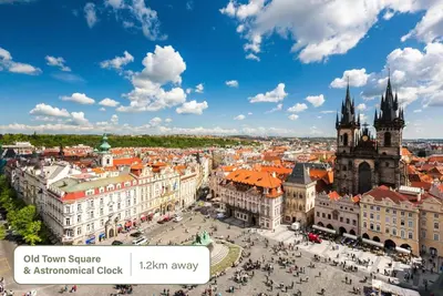 an aerial view of a city with buildings and a church at HOMELY I Central 28m2 loft I ELEVATOR I Self Check-In in Prague