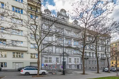 a white car parked in front of a building at HOMELY I Central 28m2 loft I ELEVATOR I Self Check-In in Prague