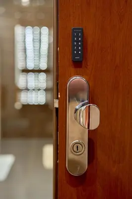 a close up of a wooden door with a handle at Heart of Prague Stylish 3BR Apartment in Prague