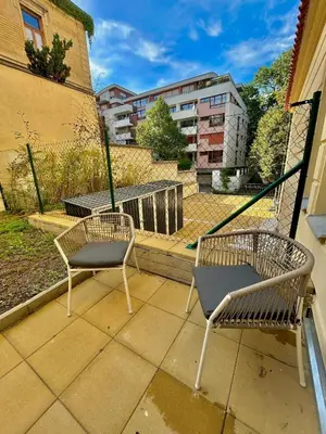 two chairs sitting on top of a balcony at Modern Luxury Apartment with Garden in Prague