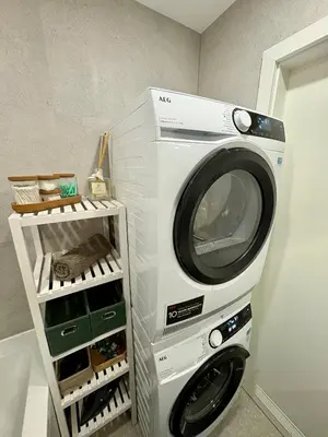 a washing machine is standing in a room at FH Apartment Letňany in Prague