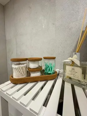 a white bench with bowls and other items on it at FH Apartment Letňany in Prague