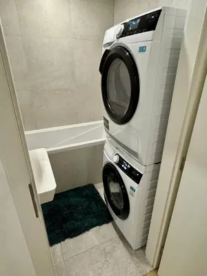 a washing machine and a washer in a bathroom at FH Apartment Letňany in Prague