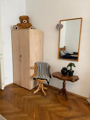 a teddy bear sitting on top of a cabinet in a room at štepánská noc B in Prague
