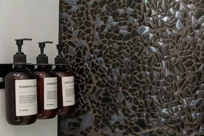 a group of three bottles of soap on a wall at Apartment in Prague near Wenceslas Square in Prague
