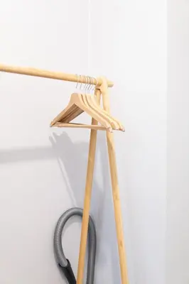a wooden stand with a hose on a white wall at Apartment in Prague near Wenceslas Square in Prague