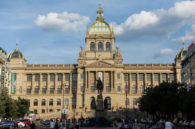 a large building with a statue in front of it at Apartment in Prague near Wenceslas Square in Prague