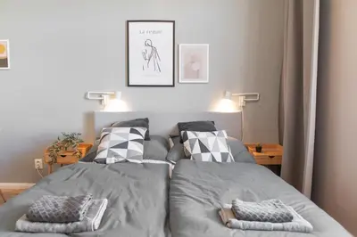 a bed in a bedroom with two pillows on it at Apartment in Prague near Wenceslas Square in Prague