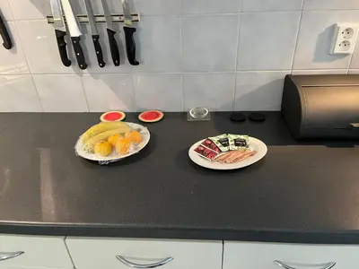 two plates of fruit on a counter in a kitchen at Apartmán LACRON Praha in Prague
