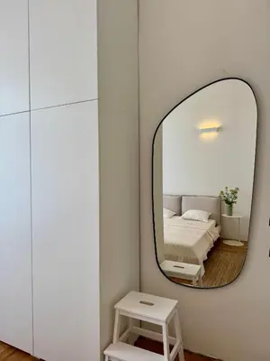 a bedroom with a mirror and a bed at Old Soul,New Style,Best location in Prague