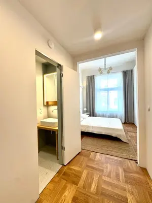 a bedroom with a bed and a window at Old Soul,New Style,Best location in Prague
