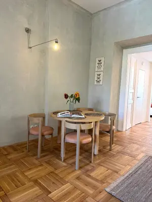 a dining room with a table and chairs at Old Soul,New Style,Best location in Prague