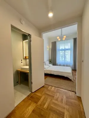 a bedroom with a bed and a window at Old Soul,New Style,Best location in Prague