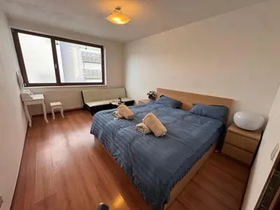 a bedroom with a bed with two pillows on it at Đã Về - Đã Tới 2 in Prague
