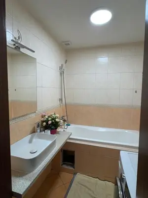a bathroom with a sink and a bath tub at Đã Về - Đã Tới 2 in Prague