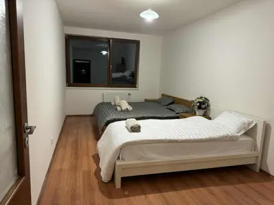 a bedroom with two beds and a window at Đã Về - Đã Tới 2 in Prague