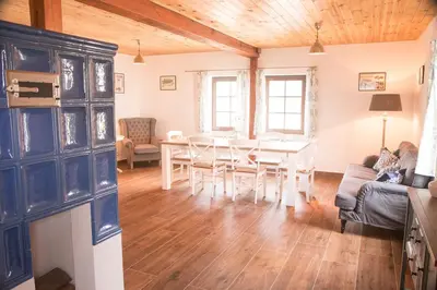 a living room with a table and a dining room at Garage u Barbory in Rakovník