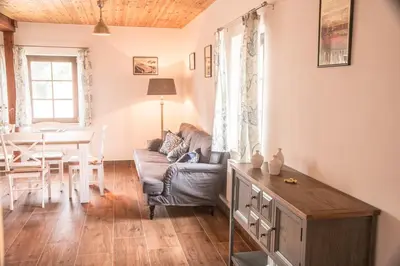 a living room with a couch and a table at Garage u Barbory in Rakovník