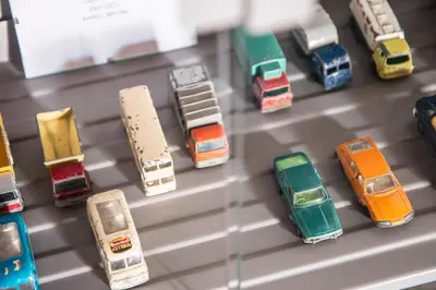 a bunch of toy cars on a display case at Garage u Barbory in Rakovník