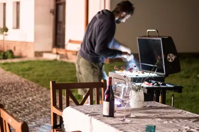 a man is standing at a table with a tableablishthritisthritisthritisthritisthritis at Garage u Barbory in Rakovník