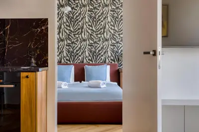 a bedroom with a bed and a large window at Boutique Apartment - 2 Double Beds and Balcony in City Centre by Gravity Prague in Prague