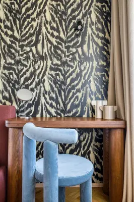 a living room with a couch and a picture on the wall at Boutique Apartment - 2 Double Beds and Balcony in City Centre by Gravity Prague in Prague