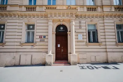 a building with a wooden door in front at Prague Days - Apartments with AC in Vinohrady in Prague