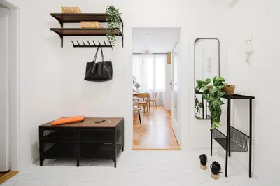 a living room with a desk and a hallway at Prague Days - Two Bedroom Apartment with AC next to National Theatre in Prague