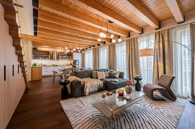 a living room with a couch and a table at Prague Days - Luxurious 3BDR Maisonette w AC & Balcony & Desk in Prague