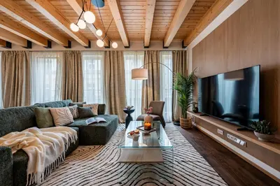 a living room with a couch and a flat screen tv at Prague Days - Luxurious 3BDR Maisonette w AC & Balcony & Desk in Prague