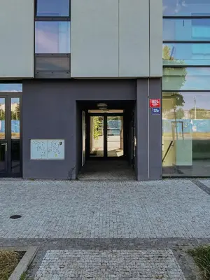an entrance to a building with an open door at Prague Days - Family Friendly One-Bedroom Apartment with Balcony, TV & Netflix in Holešovice in Prague