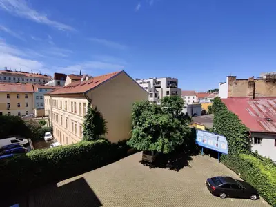 a car parked in a parking lot in a city at Cozy Flat at Žižkov & Free Parking in Prague