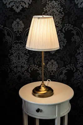 a table with a lamp on top of it at Premium Dog Suite in Prague